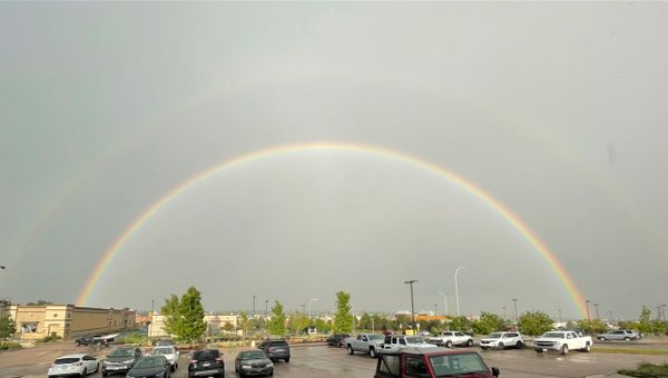 Primary and secondary rainbow with dark band between.